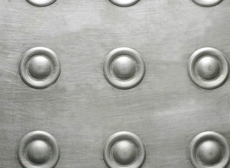 A piece of aluminum plate with special texture projections.