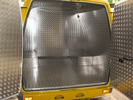 A insulated truck inner surface covered by the diamond plate.